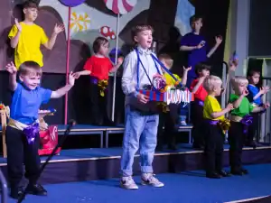 Children performing on stage at Inchmarlo, showcasing local entertainment and community events.