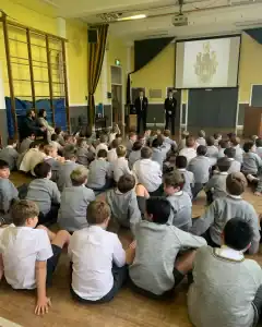 Students attending assembly at Inchmarlo School, engaging in educational activities.