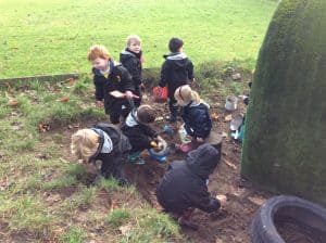 Children exploring outdoors at Inchmarlo estate in Scotland.