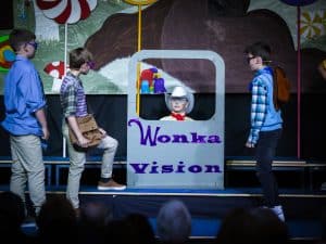 Children performing on stage at Inchmarlo, showcasing engaging activities and entertainment for kids.