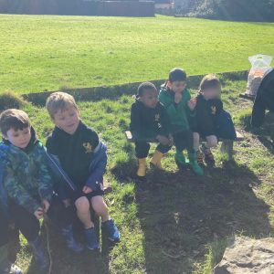 Children sitting on a park bench outdoors at Inchmarlo.