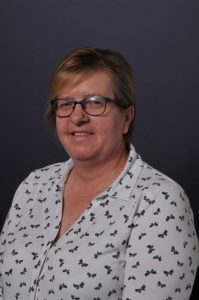 Portrait of a woman at Inchmarlo, showcasing the estate's scenic surroundings and elegant atmosphere.