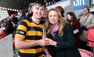 Young athlete with woman celebrating victory at Inchmarlo.