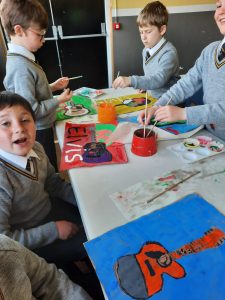 Children painting and creating arts at Inchmarlo educational center.