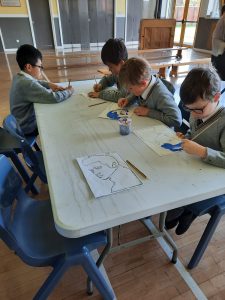 Children engaged in arts and crafts at Inchmarlo School, fostering creativity and learning skills.