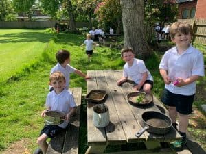 Children enjoying outdoor cooking at Inchmarlo School Garden.