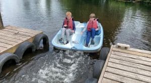 Two people enjoy boat launching at Inchmarlo golf estate's marina.