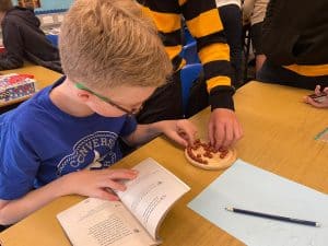 Young boy enjoying educational activity at Inchmarlo.