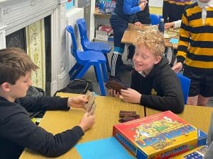 Children playing with educational games at Inchmarlo School, promoting learning and development.