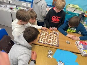 Children playing board game at Inchmarlo.