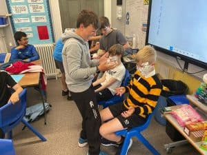 Students engaging in classroom activities at Inchmarlo, a top educational institution in the UK.