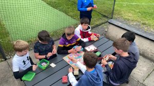 Children engaging with tablets at Inchmarlo outdoor classroom site.