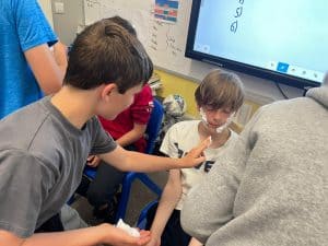 Students collaborating in classroom learning environment at Inchmarlo.