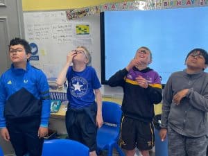 Kids enjoying fun activities at Inchmarlo school event.