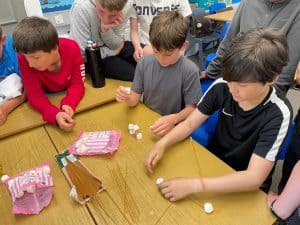 Children enjoying a fun activity at Inchmarlo school classroom, engaging learning environment.