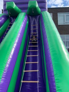 Colorful inflatable water slide at Inchmarlo outdoor park.