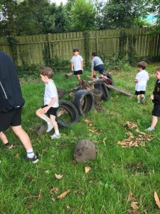 Children playing on outdoor obstacle course at Inchmarlo School, Dundee.