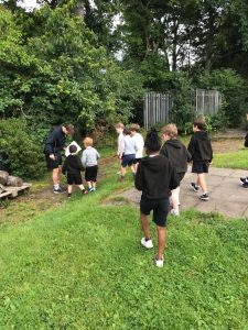Children exploring nature at Inchmarlo, enjoying outdoor activities in a scenic environment.