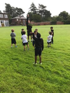 Outdoor activity at Inchmarlo, children enjoying playtime on spacious green lawns.