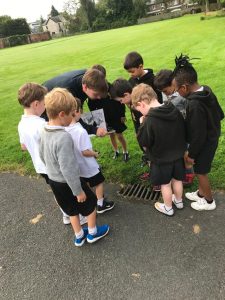 Children gathered outdoors at Inchmarlo for educational activities.