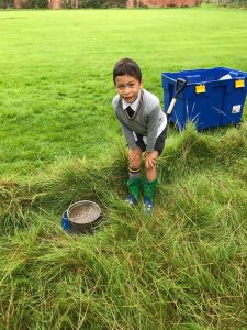 Happy boy exploring nature at Inchmarlo outdoor activities.