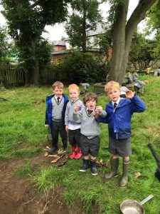 Children playing outdoors at Inchmarlo outdoor activity area.