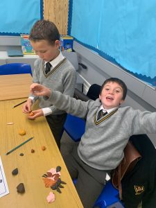 Two children playing with educational toys at Inchmarlo school.