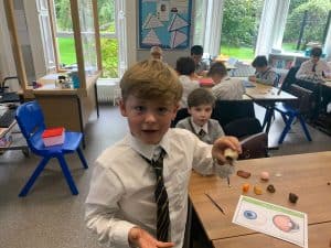 Bright classroom with children engaged in learning activities at Inchmarlo.