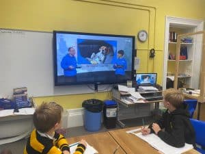 Interactive classroom with students and digital learning tools at Inchmarlo.