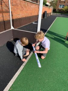 Children playing on outdoor sports court at Inchmarlo campus.
