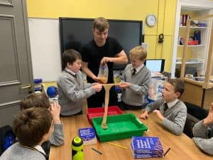 Children engaging in hands-on science activity at Inchmarlo school.