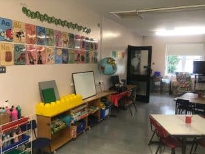 Bright classroom with educational displays and learning materials.