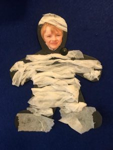 Young boy with paper crafted costume at Inchmarlo, promoting creativity and fun activities for kids.