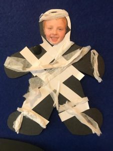 Bright smile of a child in homemade costume, cheerful and creative play.