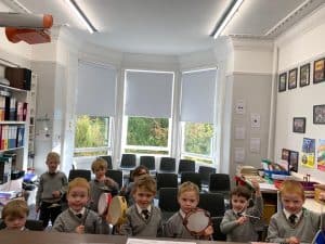 School classroom with children and books, bright learning environment in Inchmarlo.