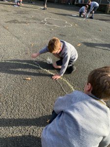 Children playing on outdoor playground at Inchmarlo, engaging in fun activities and social interaction.