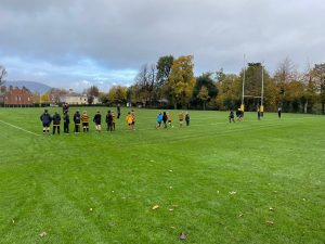 Rugby practice session at Inchmarlo Sports Field, lush green outdoor sports facility in scenic surroundings.