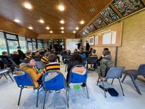 Interior view of Inchmarlo event space with attendees and presentation setup.