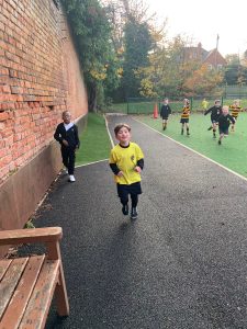 Children playing outdoors at Inchmarlo school playground, enjoying fun activities in a safe environment.