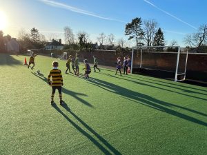 Children playing soccer at Inchmarlo school sports field.