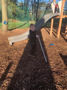 Child enjoying outdoor play at Inchmarlo estate playground.