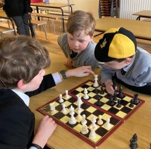 Children playing chess at Inchmarlo Care Home.