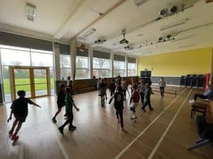 Children playing in Inchmarlo community hall, a vibrant space for activities and recreation.