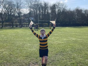 Child playing with flags on a sunny day at Inchmarlo.