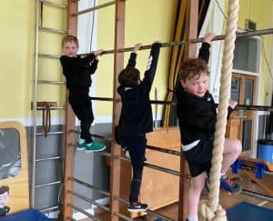 Children enjoying climbing ropes at Inchmarlo nursery.