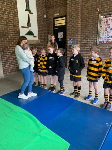 Children learning gymnastics at Inchmarlo; school trip or activity in progress.
