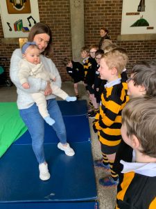 Young children participating in indoor activities at Inchmarlo school.