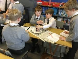 Students engaging in a group project at Inchmarlo School library.