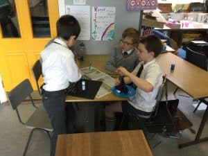 Students collaborating on projects in a classroom at Inchmarlo School.