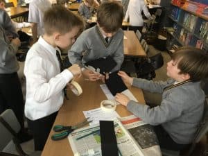 Students collaborating in a school library at Inchmarlo.
